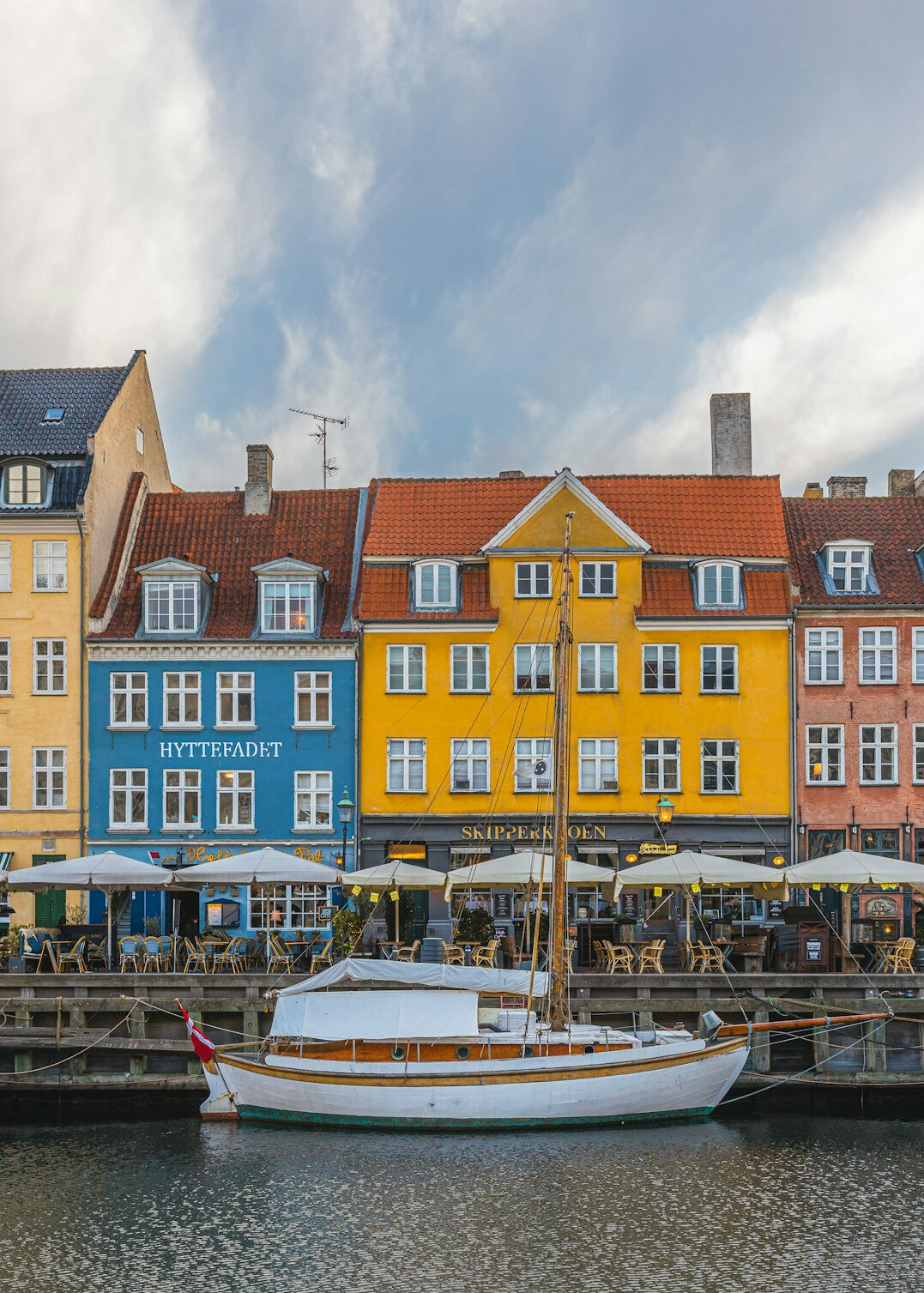 Colorful harbor front houses in Copenhagen reflected in water
