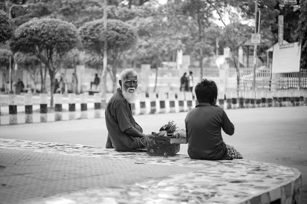 documentary photographer interviewing elder