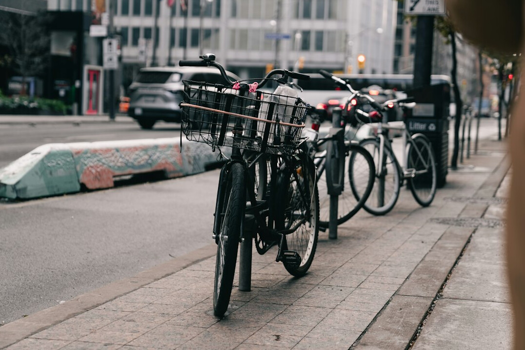 Row of bicycles parked along a city street