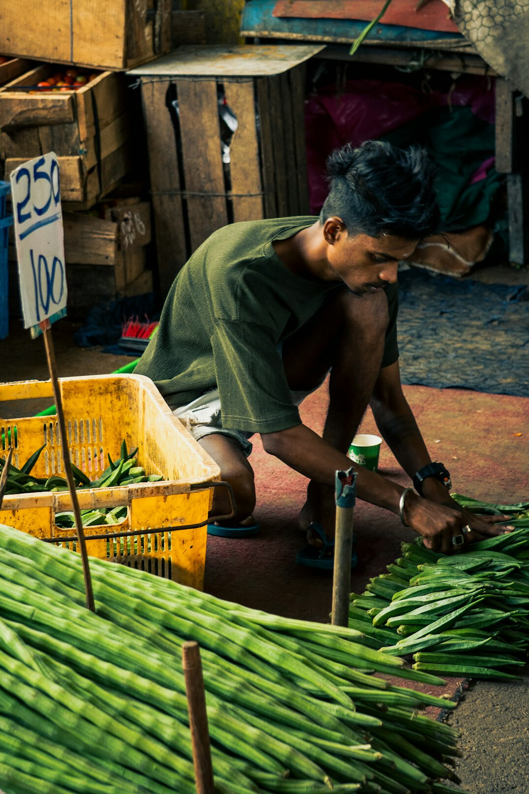 Outdoor market stall with fresh produce and a vendor