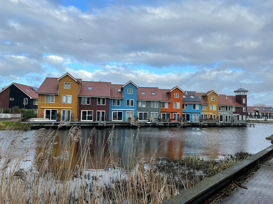 Colorful old harbor houses reflected in the water